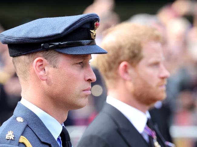 LONDON, ENGLAND - SEPTEMBER 14: Prince William, Prince of Wales and Prince Harry, Duke of Sussex walk behind the coffin during the procession for the Lying-in State of Queen Elizabeth II on September 14, 2022 in London, England. Queen Elizabeth II's coffin is taken in procession on a Gun Carriage of The King's Troop Royal Horse Artillery from Buckingham Palace to Westminster Hall where she will lay in state until the early morning of her funeral. Queen Elizabeth II died at Balmoral Castle in Scotland on September 8, 2022, and is succeeded by her eldest son, King Charles III.  (Photo by Chris Jackson/Getty Images)