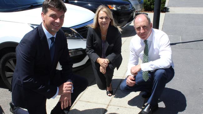 Angus Taylor, Cr Julie Greer and Luke Howarth discuss smart parking in The Corso at North Lakes in 2017. Photo: Alan Quinney