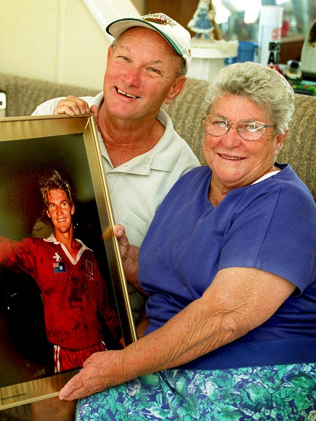 Harold and Rita Langer holding picture of their son Allan, in 2001.