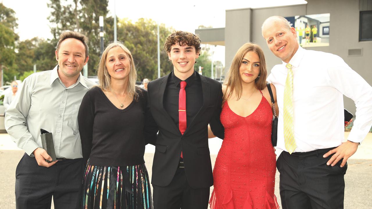 Brady Kriders, third left, with step dad James, mum Jayne and dad Marc and fellow graduate Claire Sherlock at the Belmont High School year 12 graduation at GMHBA Stadium. Picture: Alison Wynd