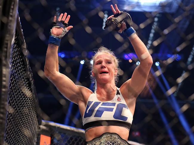Holly Holm celebrates her victory over Ronda Rousey.