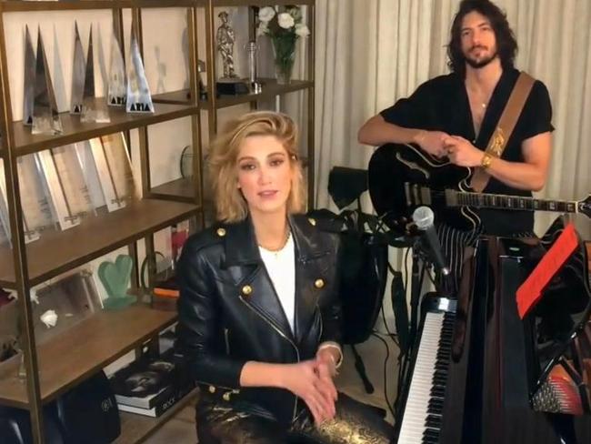 The Aussie star performed in front of a bookshelf stacked with ARIA Awards.