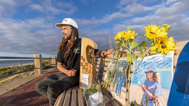 The uncle of Khai Cowley, Adam Barley with flowers and his handmade memorial to Khai at Seaford Beach. Picture: Ben Clark