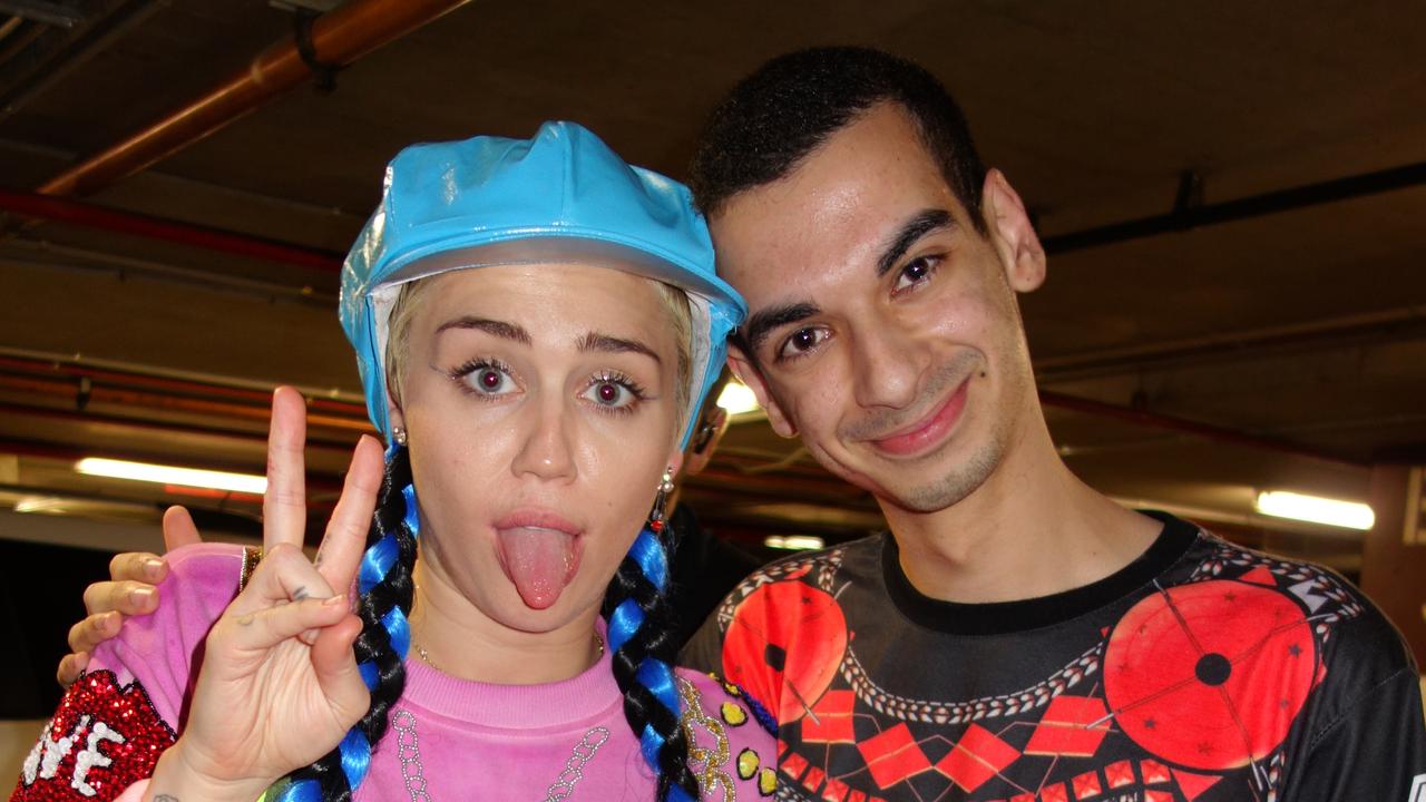 Miley Cyrus with Beau Lamarre-Condon.