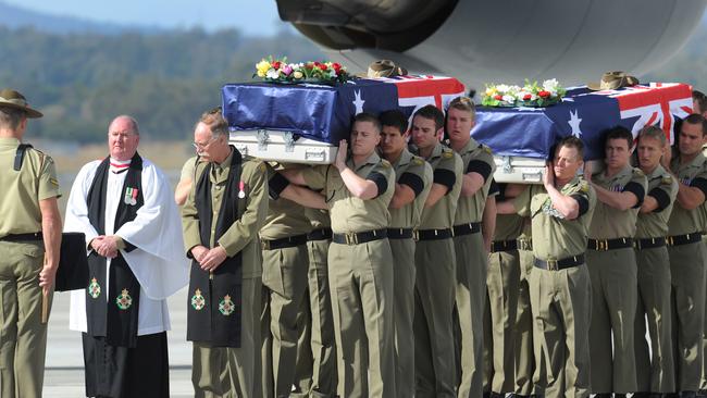 The bodies of Australian soldiers Jacob Moerland and Darren Smith arrive at the RAAF Amberley Airbase in 2010. Picture: AAP Image/Dave Hunt