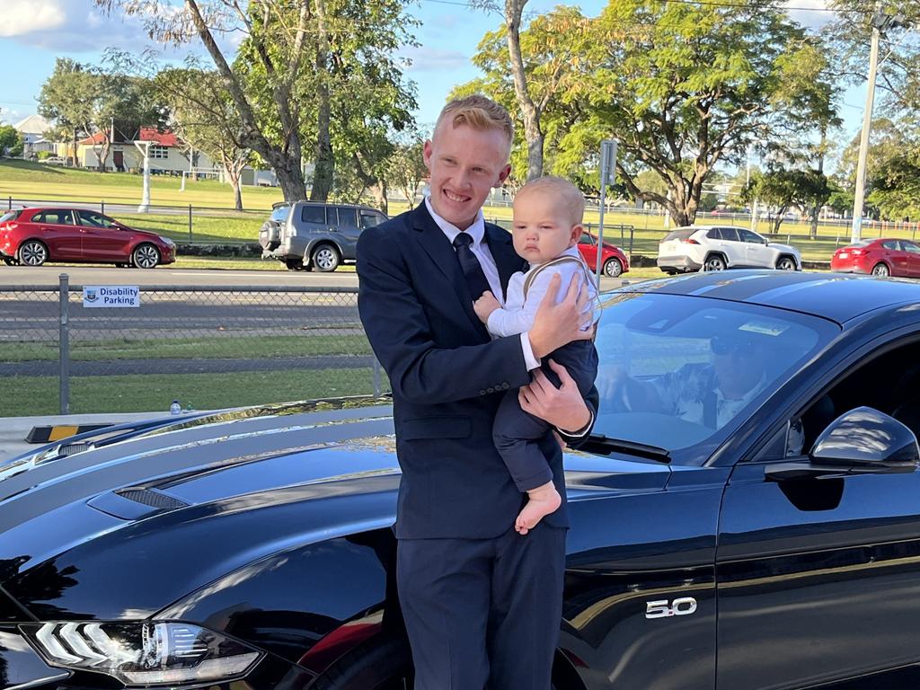 Hunter Van Veelen arrives at the formal with baby Zeph.