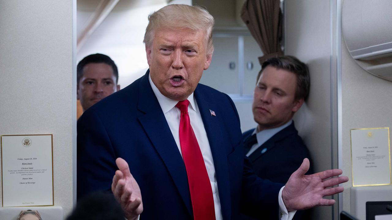 Campaign manager Bill Stepien, right, stands alongside US President Donald Trump aboard Air Force One earlier this year. Picture: AFP)