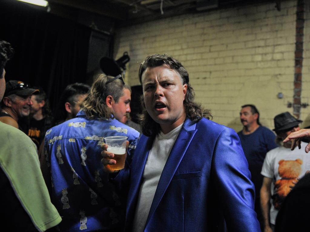 Participant Dane Wildey is seen in the green room backstage during Mulletfest, a special event designed to celebrate the hairstyle that's all about business at the front, party at the back, at Chelmsford Hotel in Kurri Kurri, NSW. (AAP Image/Perry Duffin) 