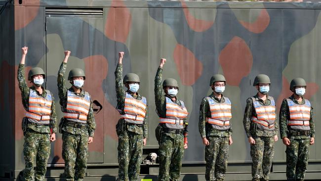 Taiwan's chemical corps personnel stand in formation during a demonstration as Taiwan's President Tsai Ing-wen inspects troops in Tainan, southern Taiwan. Picture: AFP