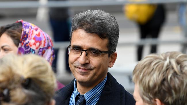 Dr Seyyed Farshchi departs the County court of Victoria, Melbourne, Monday, September 23, 2019. Dr. Seyyed Farshchi and his wife Naghmeh Mostafei have been committed for trial over slavery-related charges after allegedly forcing an Iranian asylum seeker to work at their Box Hill bakery in Melbourne's east. (AAP Image/James Ross) NO ARCHIVING