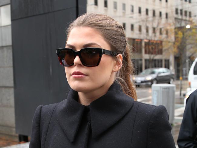 Belle Gibson arrives at the Federal Court in Melbourne, Thursday, June 20, 2019. Cancer con artist Belle Gibson is facing court over failure to pay a $410,000 penalty. (AAP Image/David Crosling) NO ARCHIVING