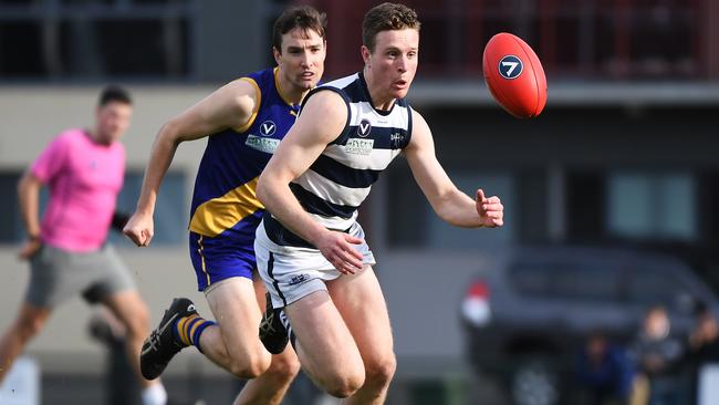 Jacob Jess (Old Geelong) leads the race to the ball. Picture: James Ross