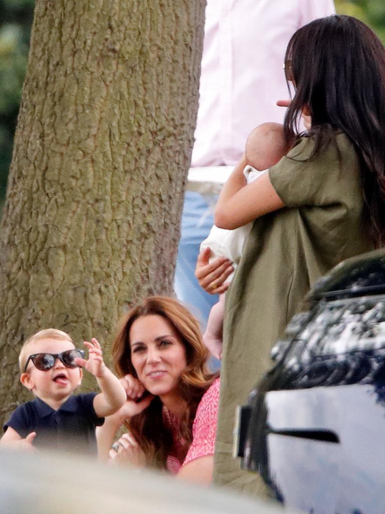 Prince Louis entertains Kate Middleton and Meghan Markle, holding baby Archie, at the King Power Royal Charity Polo Match on July 10, 2019. Picture: Max Mumby/Indigo/Getty Images