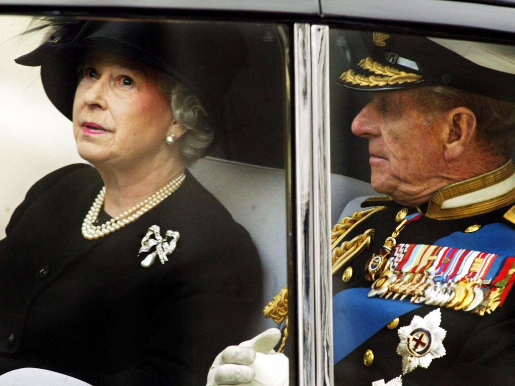 The Queen leaves Westminster Abbey with the Duke of Edinburgh after the funeral for her mother in April 2002. Picture: AFP