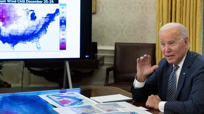 US President Joe Biden speaks during a briefing on the winter storm system traversing the US and the expected impacts, in the Oval Office of the White House in Washington, DC, on December 22, 2022. (Photo by Brendan Smialowski / AFP)