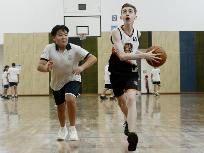 Young Basketballers L to R:  Liam Wong -13 and Baidyn Milera -13 on the court at St Ives High school. Young basketballers are being turned away from the game as sporting clubs await the construction of much-needed basketball facilities in SydneyÃ¢â¬â¢s north shore. Picture: John Appleyard