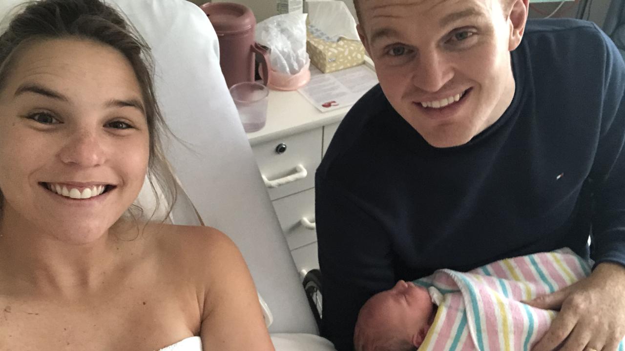 Alex McKinnon and Teigan Power with their first child, Harriet Anne.