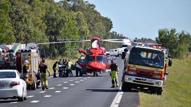 A badly injured man being loaded onto an emergency helicopter after a horror accident between Cardwell and Ingham. Picture: CAMERON BATES