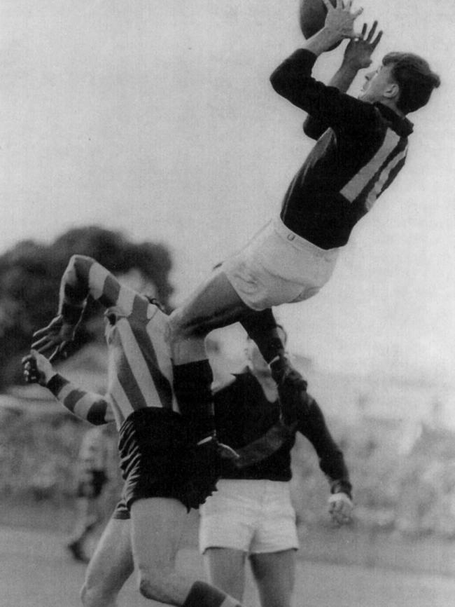 John Coleman takes a big mark for Essendon in 1951.