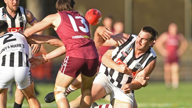 Payneham Norwood Union’s Nick Jolly is tackled during the division one grand final against Prince Alfred Old Collegians at Thebarton Oval. Picture: Tom Huntley