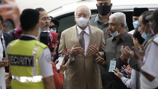 Najib Razak, centre, arrives at court in Kuala Lumpur on Friday. Picture: AP