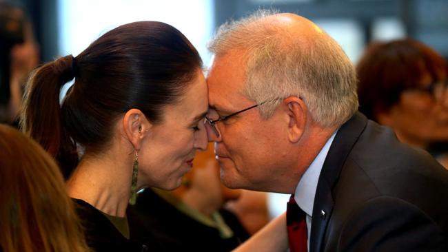 Jacinda Ardern and Scott Morrison take part in a traditional hongi greeting in Queenstown on Sunday. Picture: Calum Robertson