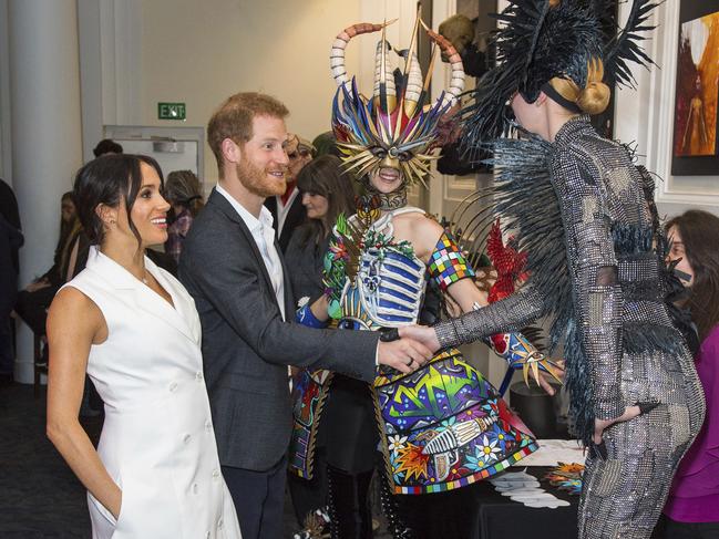 Britain's Prince Harry and Meghan, Duchess of Sussex meet actors in costume during a visit to Courtenay Creative in Wellington, New Zealand, Monday, Oct. 29, 2018. Prince Harry and his wife Meghan are on day 14 of their 16-day tour of Australia and the South Pacific. (Dominic Lipinski/Pool Photo via AP)