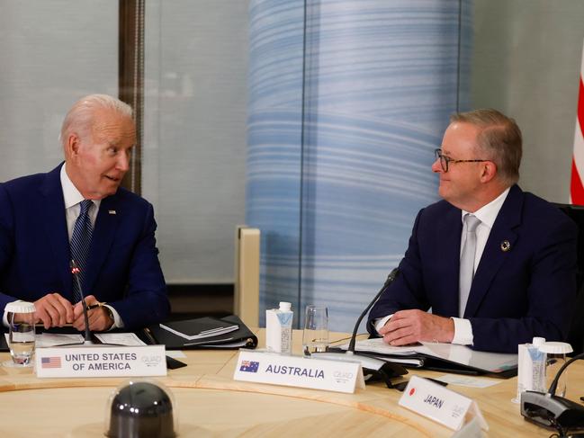 US President Joe Biden (L) and Australia's Prime Minister Anthony Albanese attend a quad meeting with Japan's Prime Minister Fumio Kishida (not pictured) and India's Prime Minister Narendra Modi (not pictured) on the sidelines of the G7 Leaders' Summit in Hiroshima on May 20, 2023. (Photo by JONATHAN ERNST / POOL / AFP)