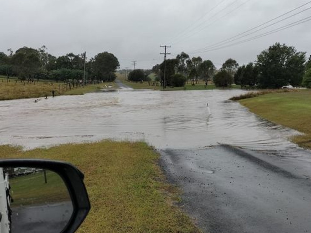 Flooding across Llewellyn Street at Goomeri. Photo/Ricky Arthur