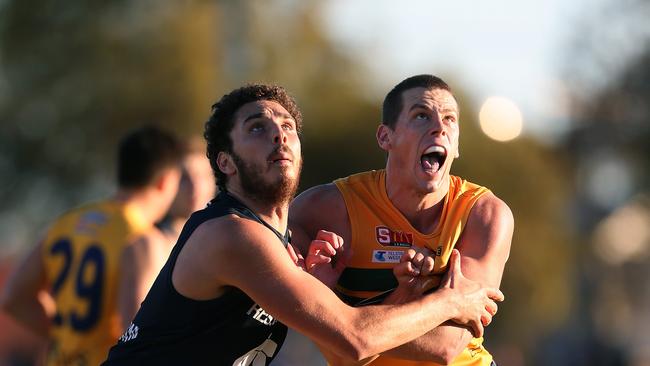 Marc Borholm battles South Adelaide and Abe Davis. Picture: Dean Martin