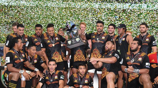 Chiefs players celebrate with the winners trophy after winning the Final of the Global Rugby Tens.