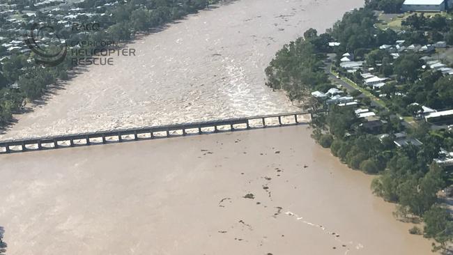 Flood water flows through the Fitzroy River Barrage into Rockhampton.