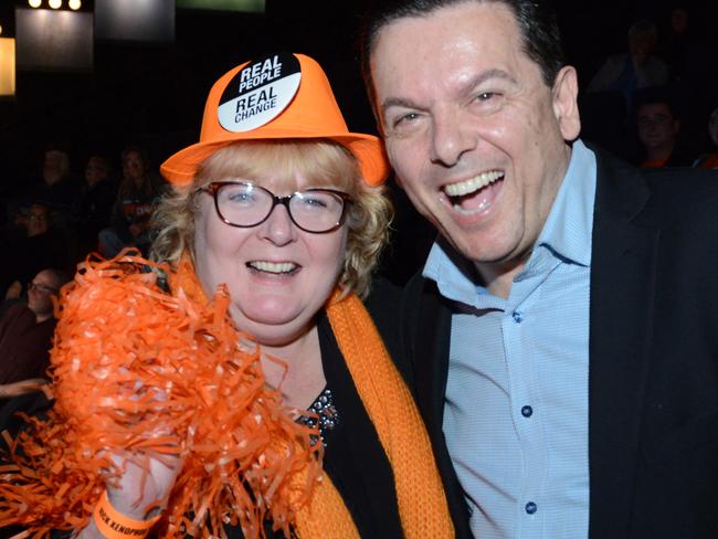 Orange is the new political force in Australian politics. Nick Xenophon with a supporter at a post-election celebration. Picture: Brenton Edwards