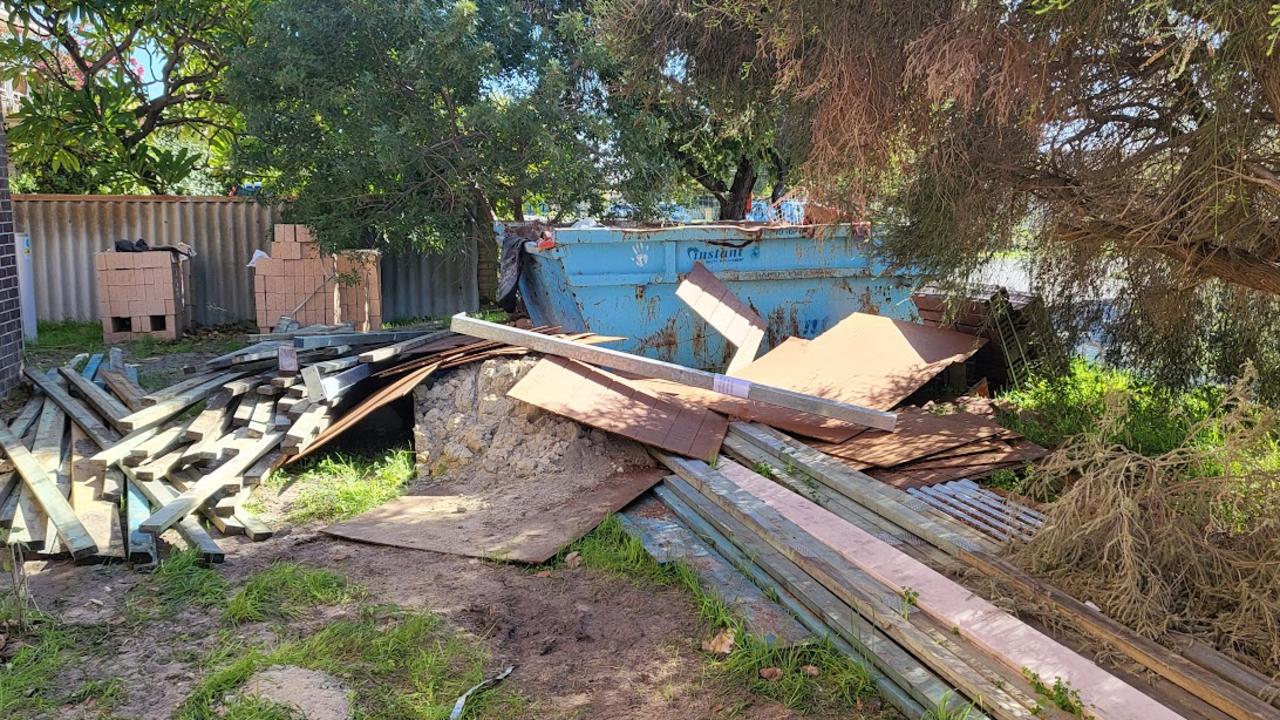 Rubbish dumped on the front lawn.