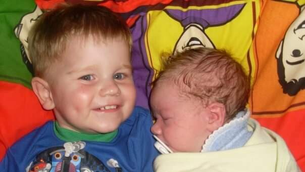 Baby Lucas with an older sibling. Picture: Supplied