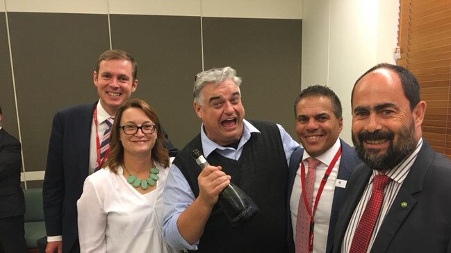 Labor MP Brian Mitchell holding a bottle. Picture: Supplied.