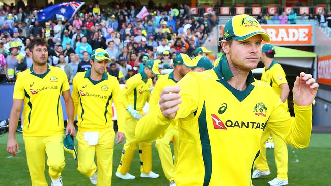 MELBOURNE, AUSTRALIA — JANUARY 14: Steven Smith, captain of Australia sleads his side onto the field during game one of the One Day International Series between Australia and England at Melbourne Cricket Ground on January 14, 2018 in Melbourne, Australia. (Photo by Scott Barbour/Getty Images)