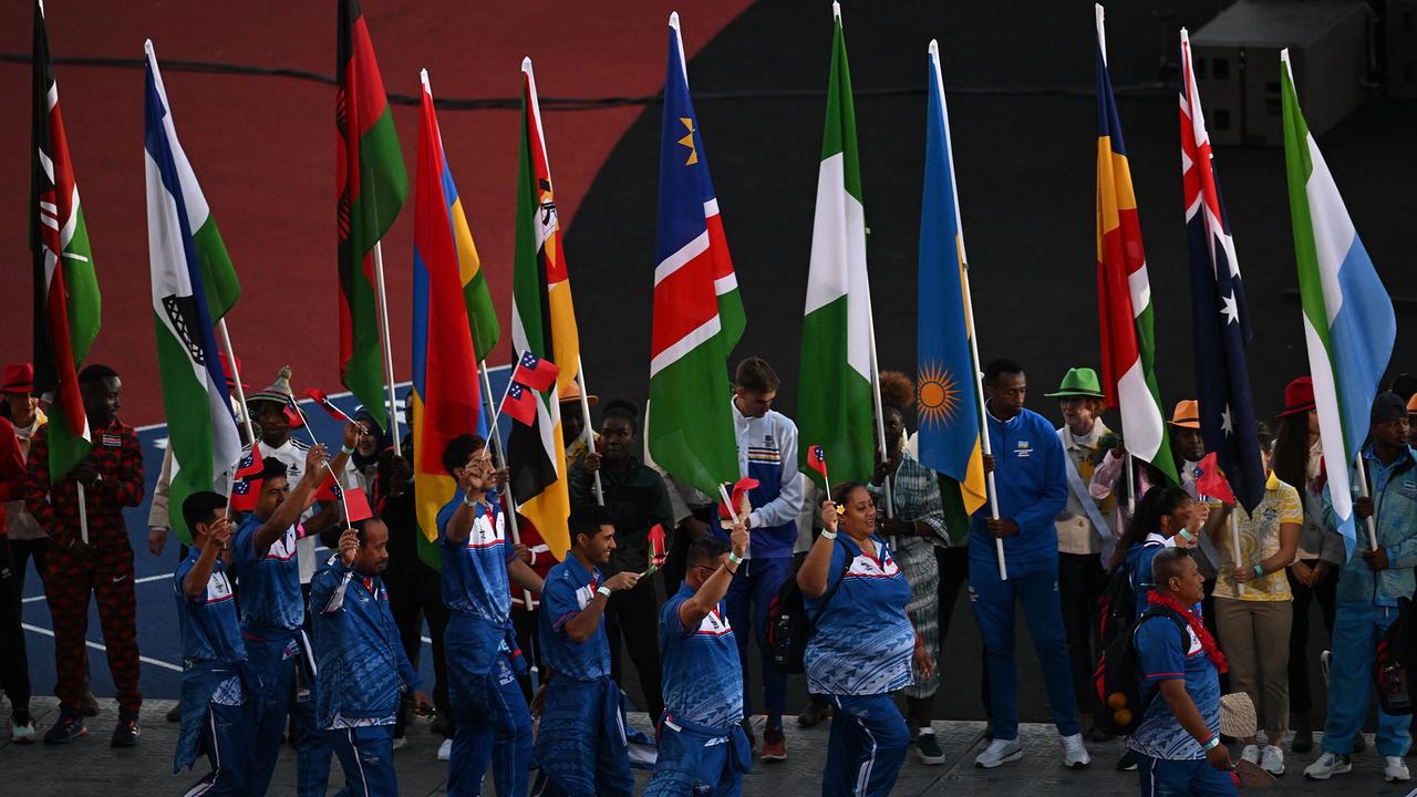 Athletes arrive to take part in the closing ceremony.