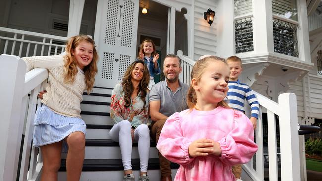 Joey and Phoebe Dean with their children, Audrey 9, Albert 7, Vivian 6 and Peggy 3 at their house in New Farm. Picture: Adam Head