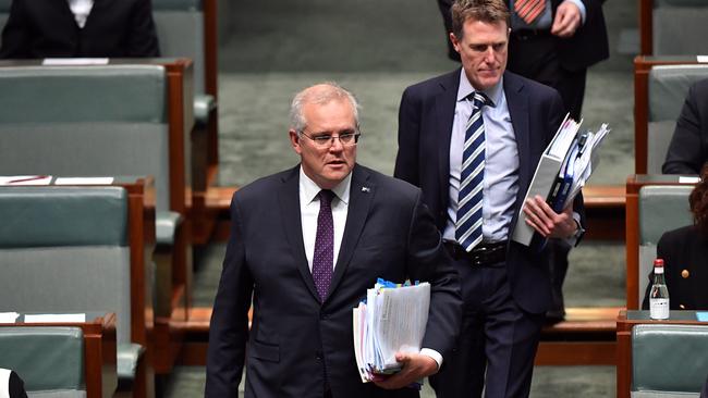 Minister for industry, science and technology Christian Porter follows Prime Minister Scott Morrison into Question Time on Wednesday. Picture: Getty Images