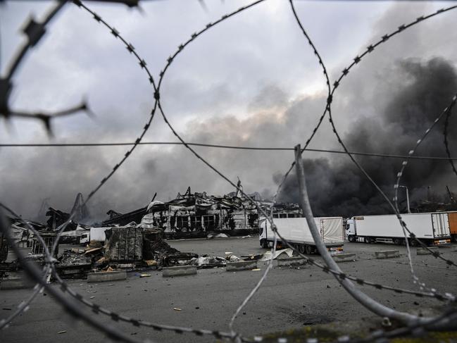 Smoke rises from a bombed warehouse in the town of Stoyanka, west of Kyiv. Picture: AFP.