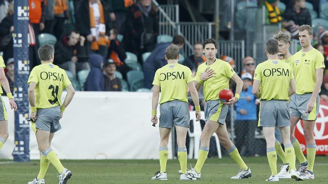 Umpires confer after the final siren. Picture: Getty Images