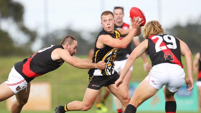 Kingborough midfielder Eddie Cole looks to evade North Launceston’s Harvey Griffiths back in round 2. Picture: Nikki Davis-Jones