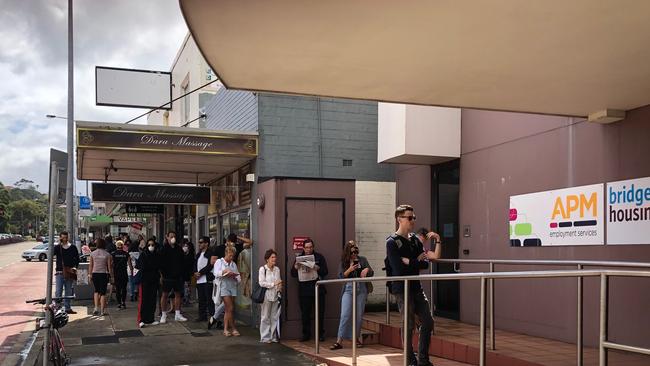 People, who lost rheir jobs due to the coronavirus sutdown in NSW, had to wait in a two-hour queue outside the Centrelink office at Brookvale after the MyGov website crashed. Picture: Jim O'Rourke