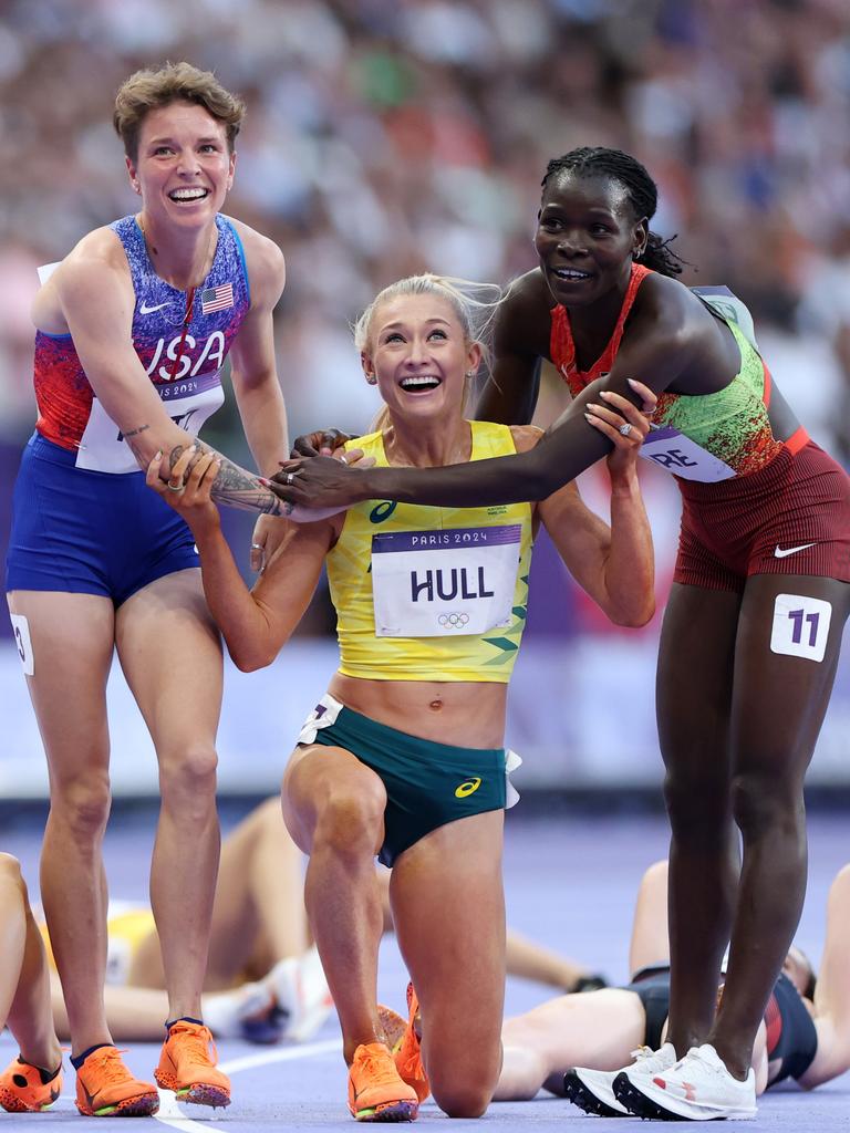 Jess Hull is congratulated by Nikki Hiltz of Team United States and Susan Lokayo Ejore of Team Kenya after winning the silver medal. Picture: Michael Steele/Getty Images