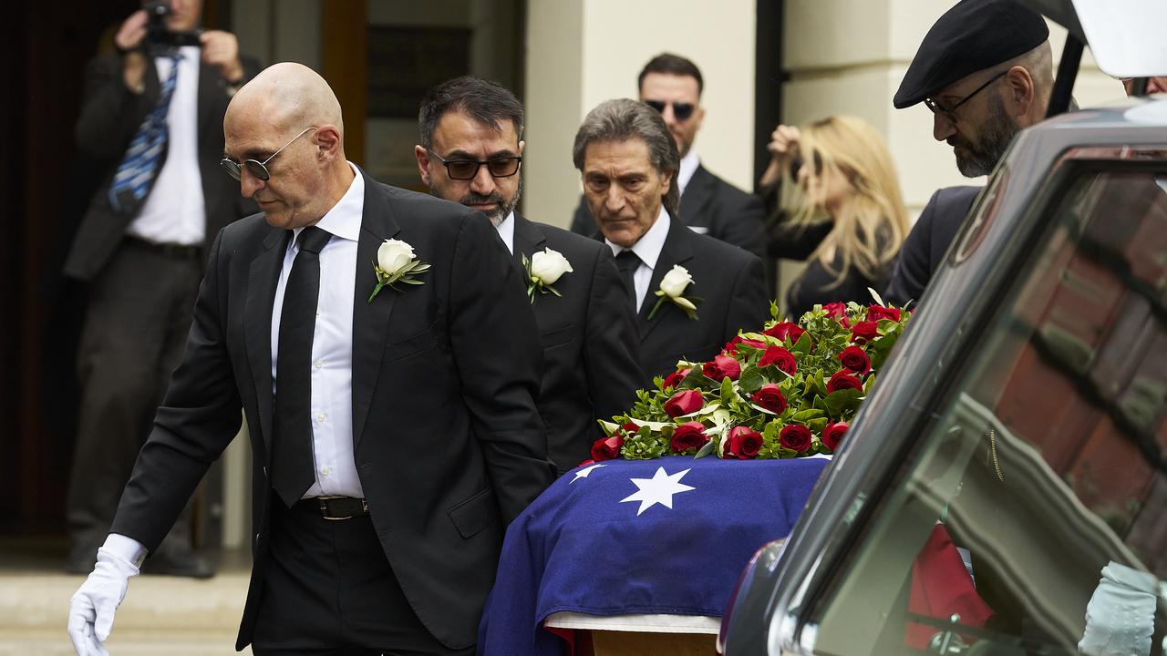 Mellick, Mark and Karl Jr Chehade helping carry the coffin. Picture: Matt Loxton