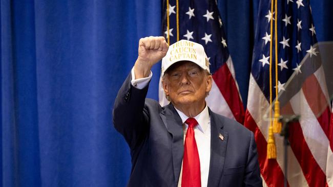 Republican presidential hopeful Donald Trump raises his fist at an event in Iowa in January. Picture: AFP