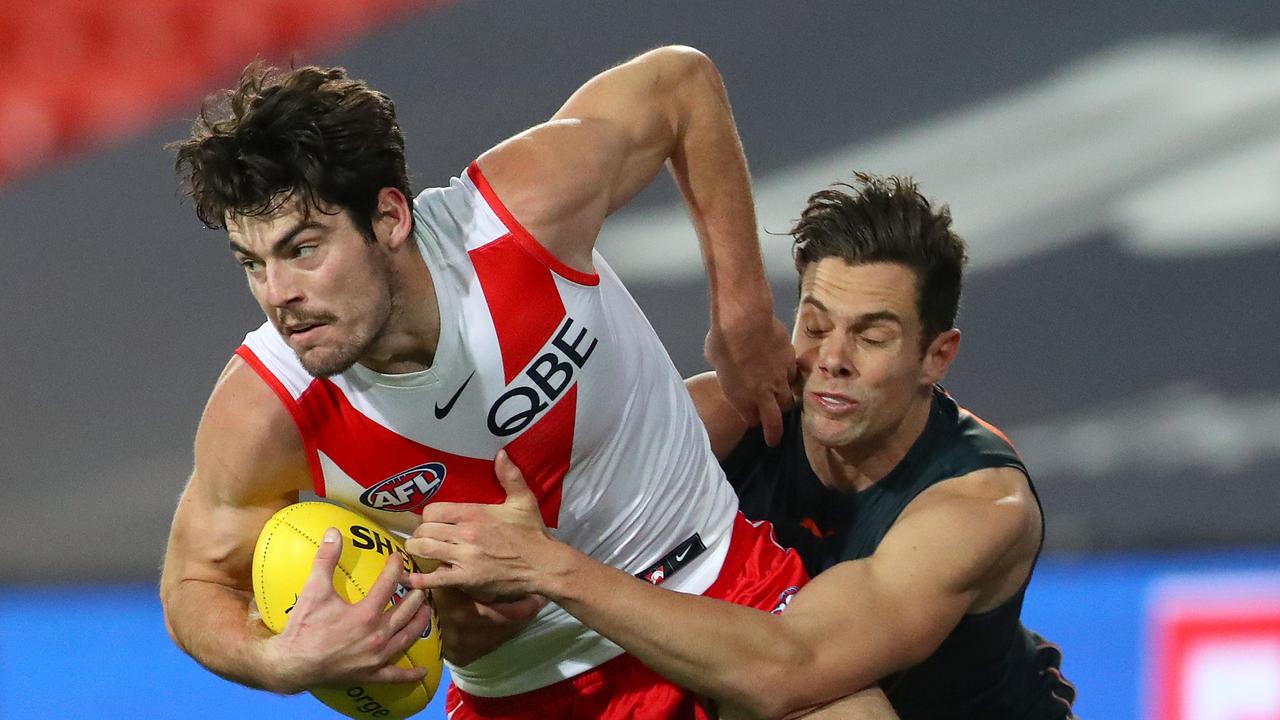 George Hewett of the Swans is tackled by Josh Kelly. Picture Getty Images