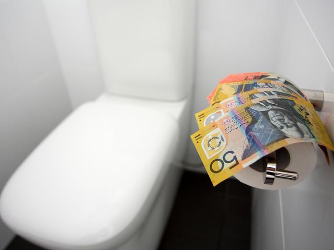 Flushing money down the toilet. Australian money in toilet, generic