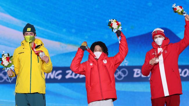 Scotty James, Ayumu Hirano and Jan Scherrer on the podium after the Men's Snowboard Halfpipe final. Picture: Patrick Smith/Getty Images